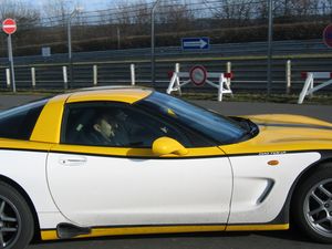 Robin passengering in a Corvette